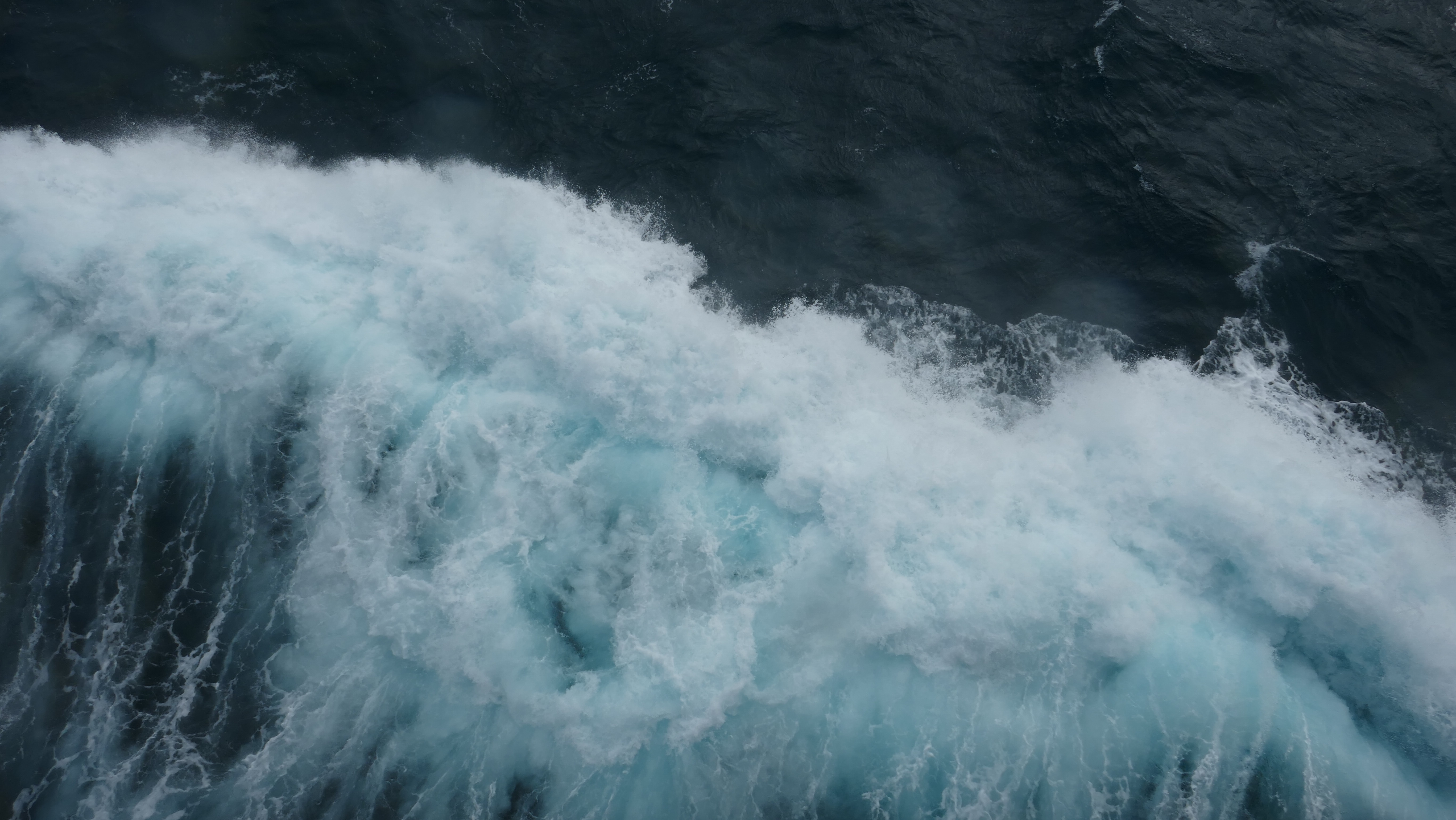 Waves at sea, representing coordinated movement and connection