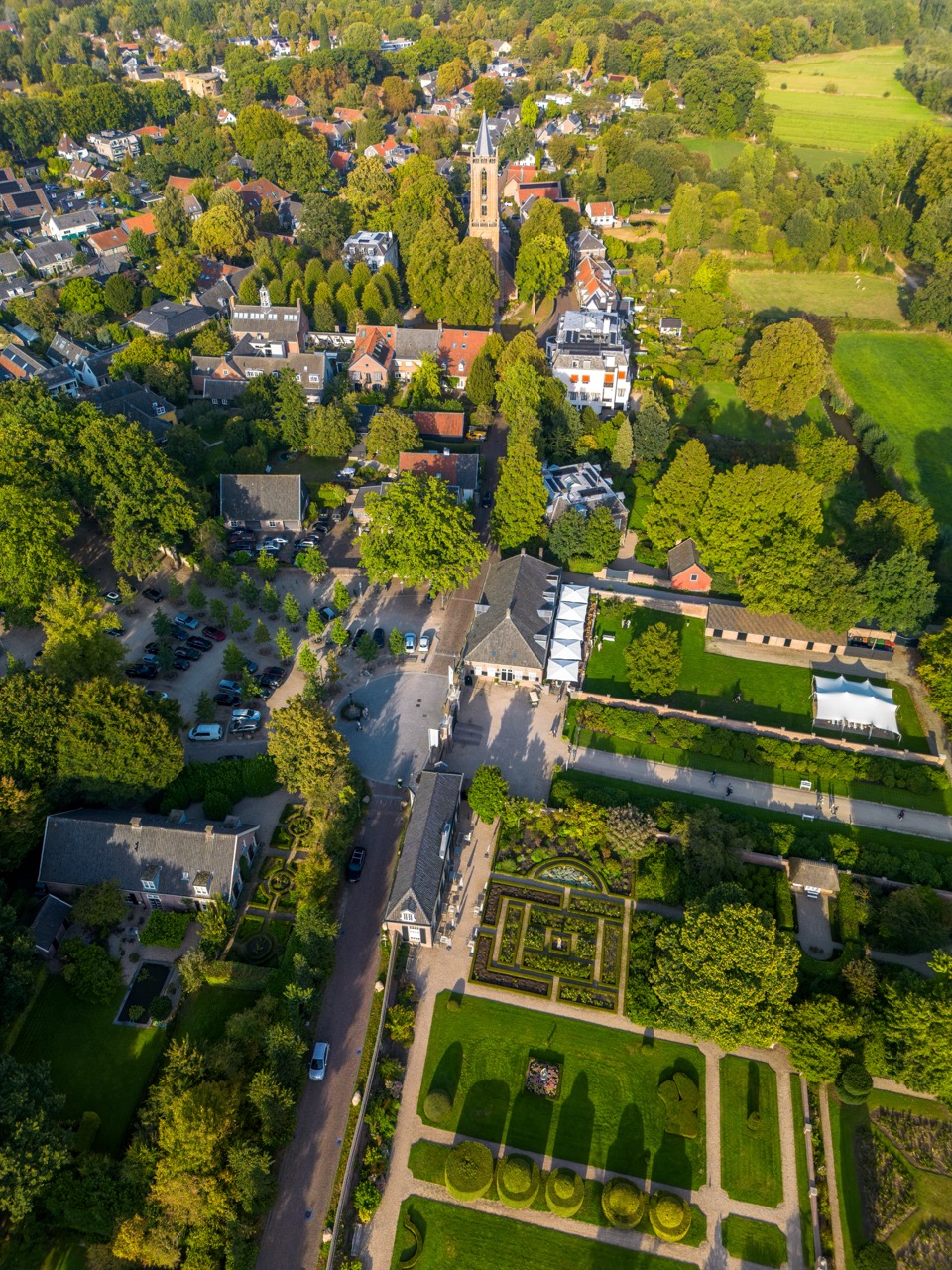 A village and gardens viewed from above